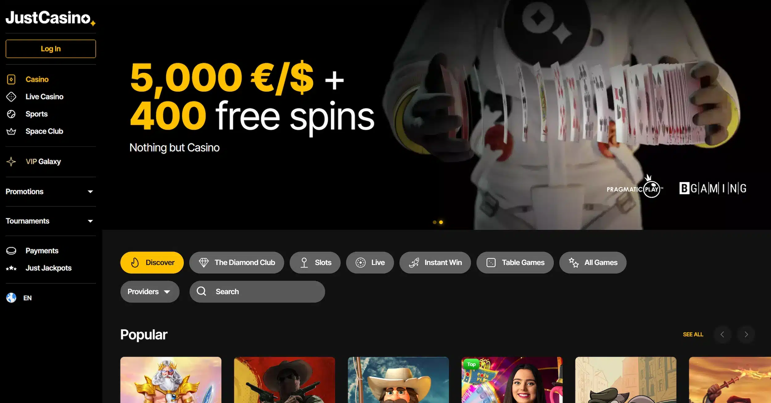 JustCasino frontpage showing welcome offer, selection of online pokies and site navigation
